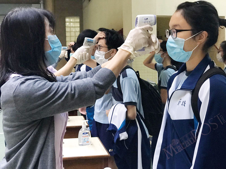 Senior secondary school pupils return to their classrooms